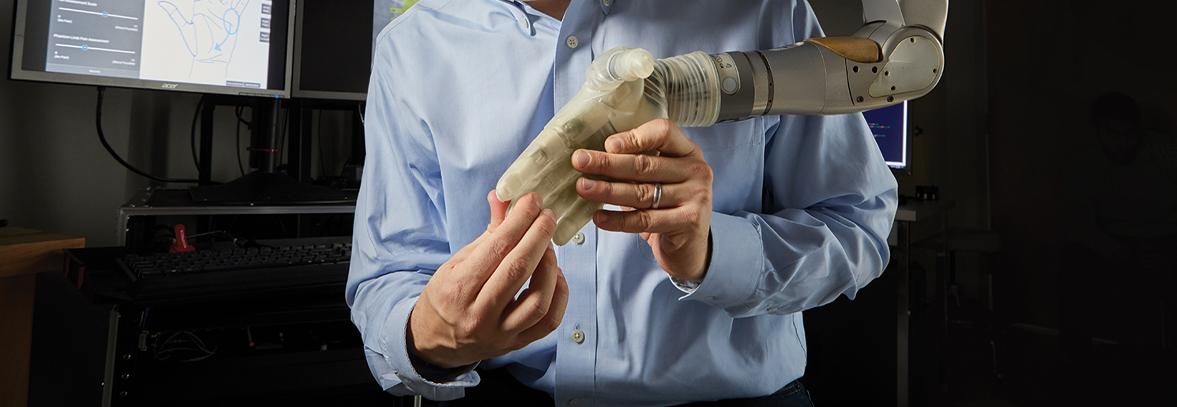 Person demonstrating a robotic hand